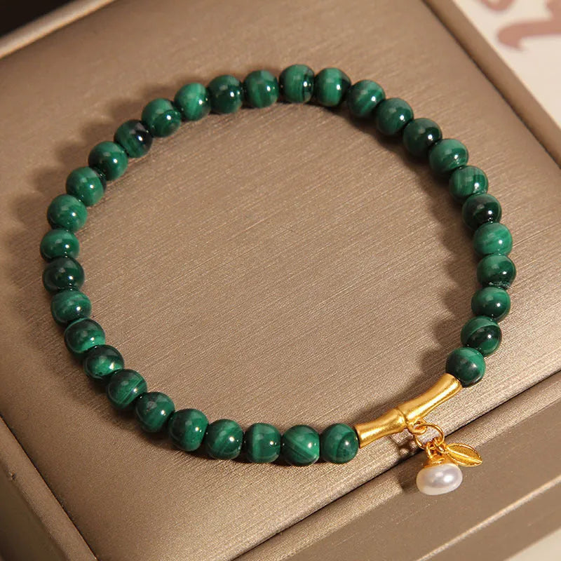Women's adjustable white crystal bracelet with lucky bamboo charm in high-rise setting