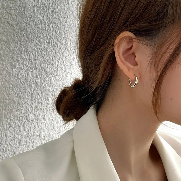 Women's geometric water drop earrings in gold and silver finishes showing three size variations