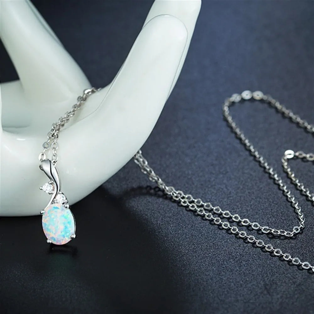 Water drop shaped opal pendant necklace with adjustable chain in white or rose gold finish