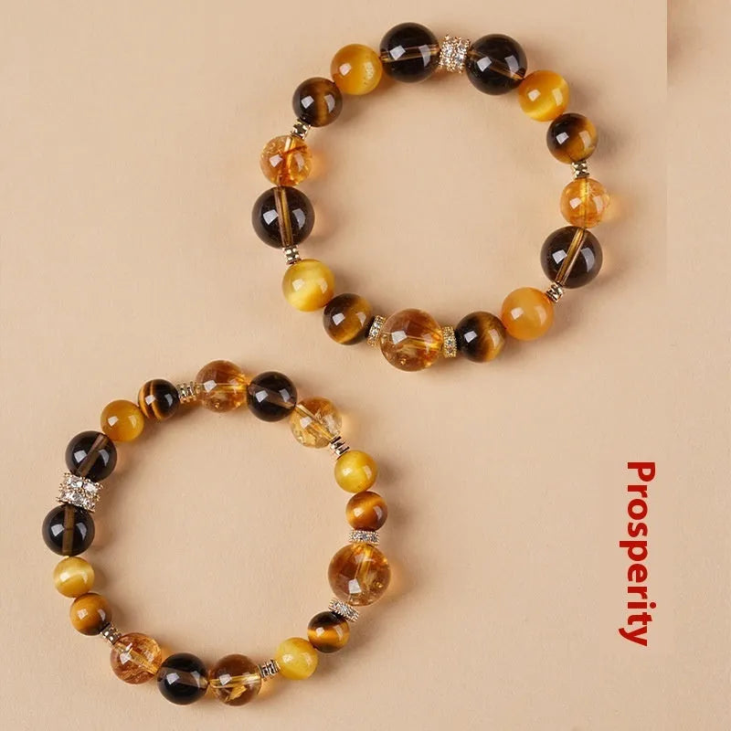 Tiger-eye crystal bracelet with Jinba symbol and geometric tower design in natural yellow