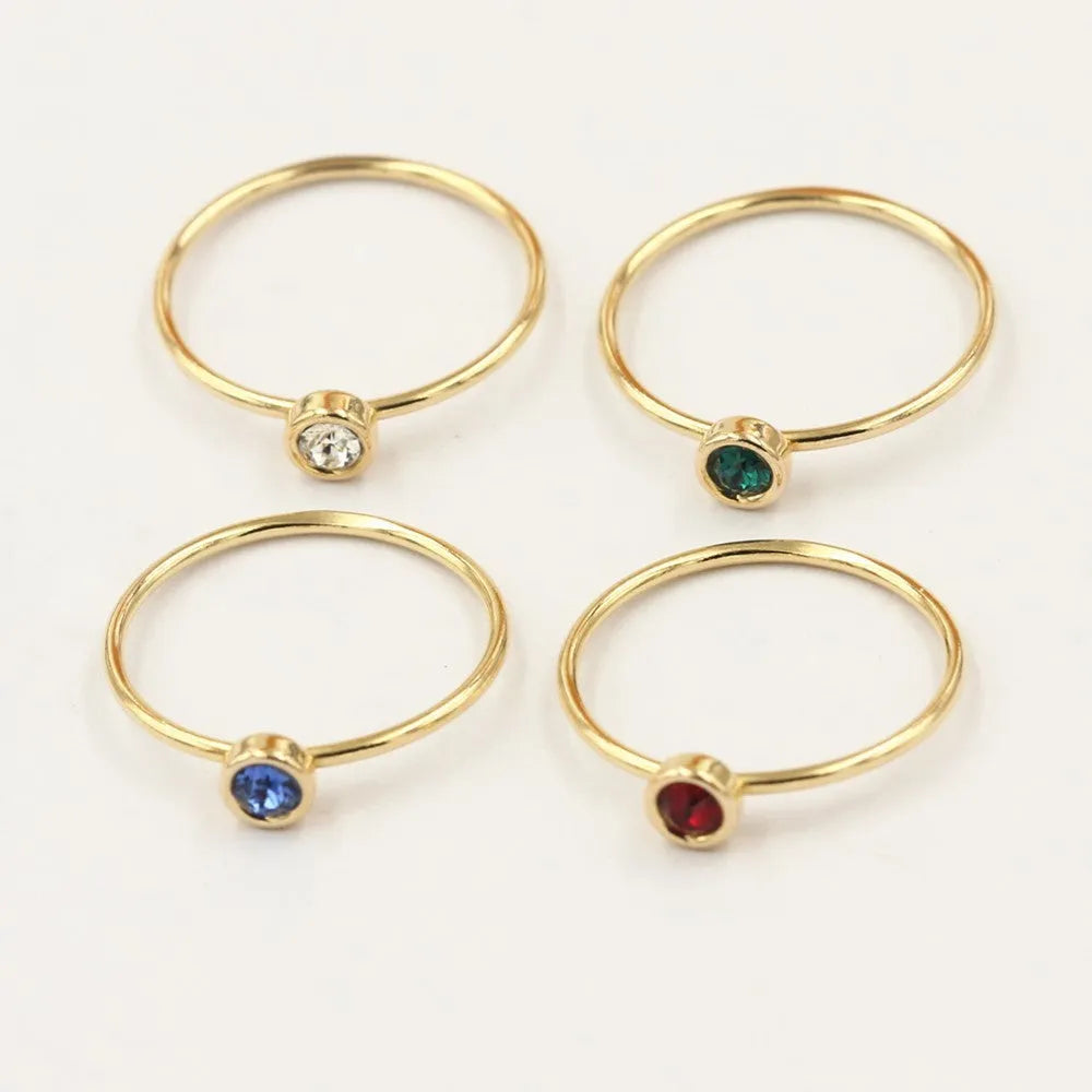 14K gilded GF zircon knuckle ring in green, blue, dark red, or white on a copper base.