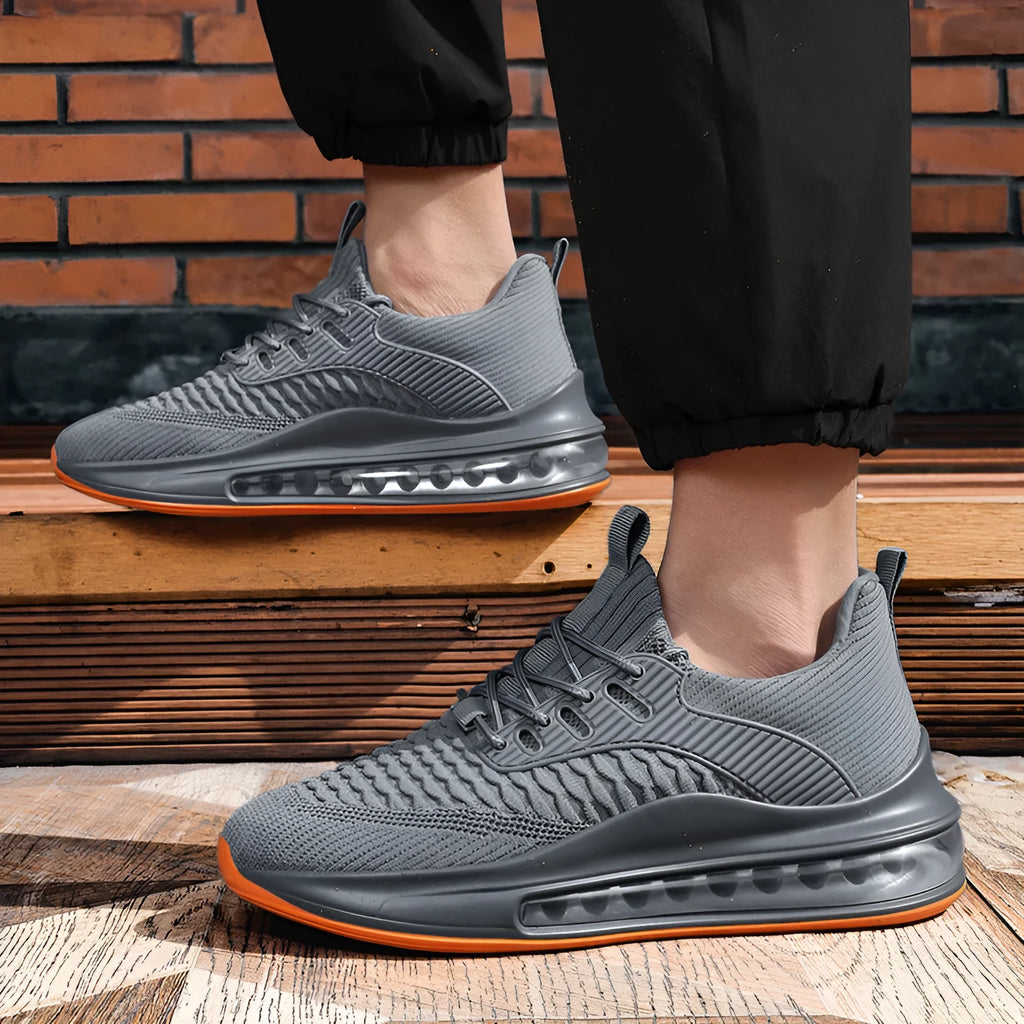 Men's black low-top lace-up running sneakers with mesh upper on a white background.