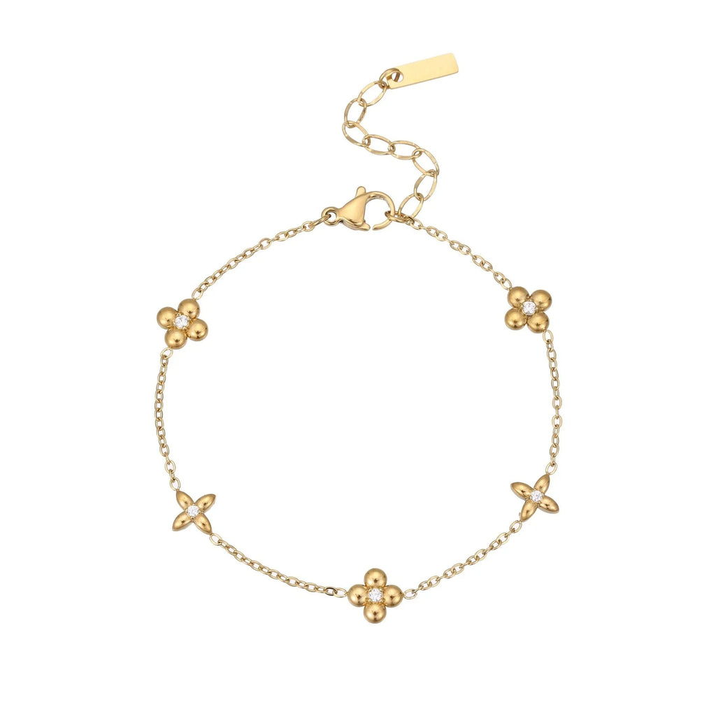 Gold electroplated stainless steel bracelet with a geometric star-shaped pendant.