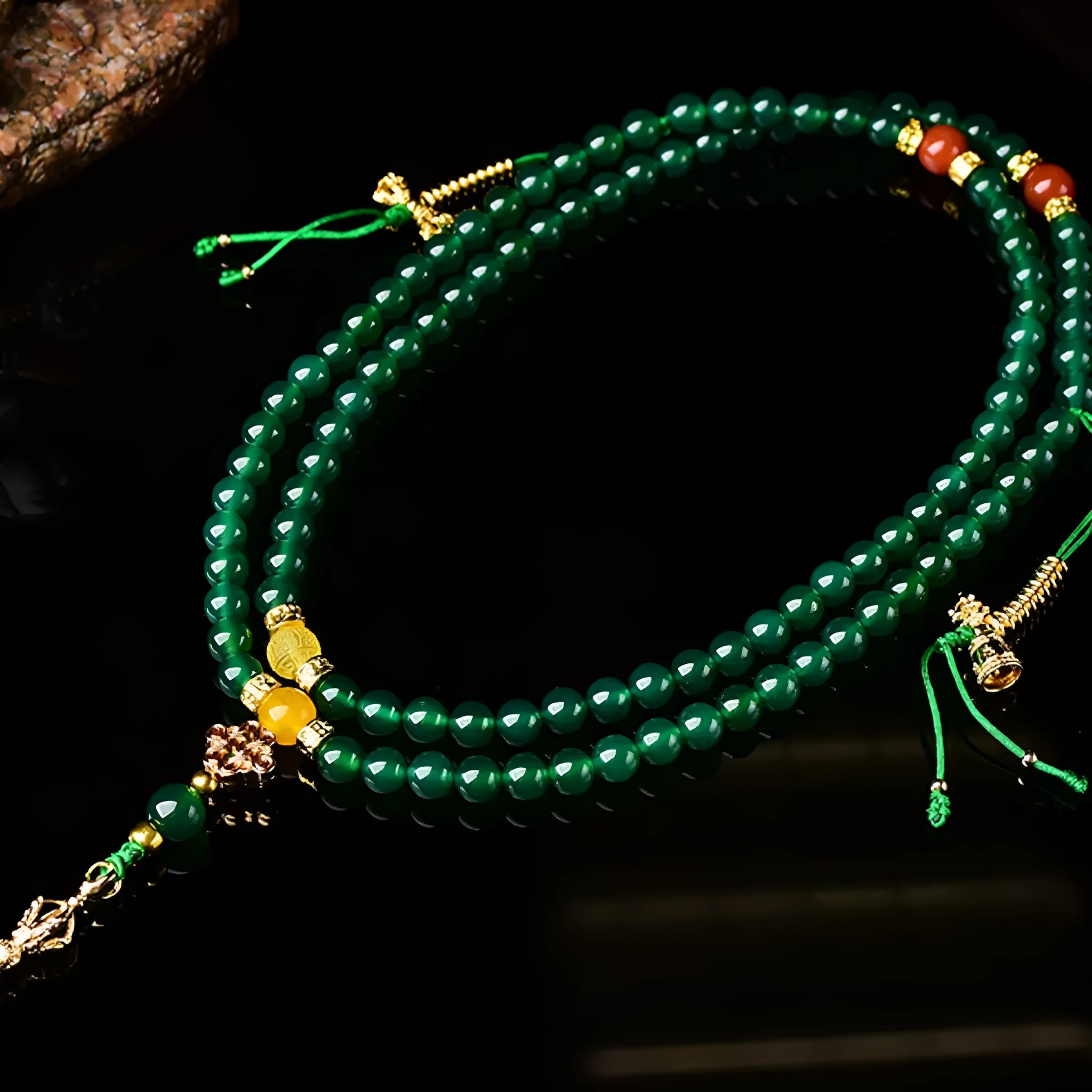 Multi-strand green agate bracelet for men and women on wrist, showing natural stone beads.