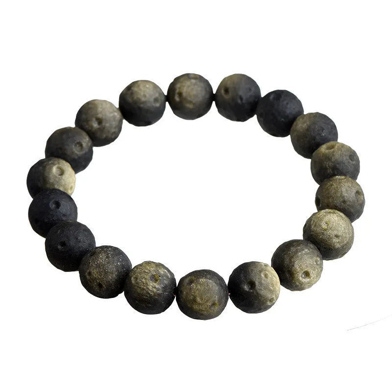 Obsidian meteorite crater ball bracelet with polished stones on adjustable string