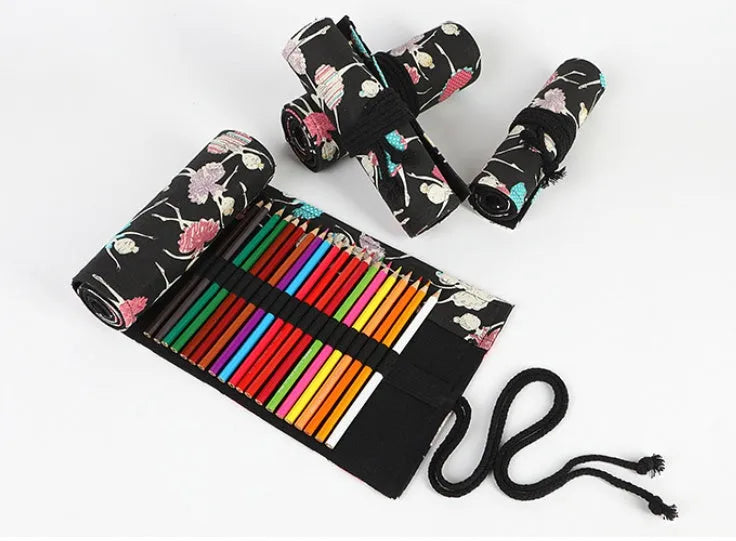 Rolled-up canvas pencil case with ballet girl print, showing multiple pencil slots.