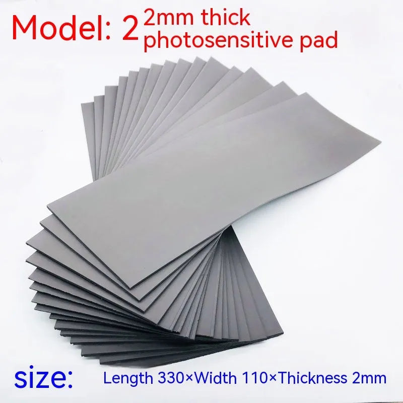 Black and grey plastic light-sensitive mat for photosensitive seal making measuring 330x110mm