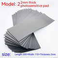 Black and grey plastic light-sensitive mat for photosensitive seal making measuring 330x110mm