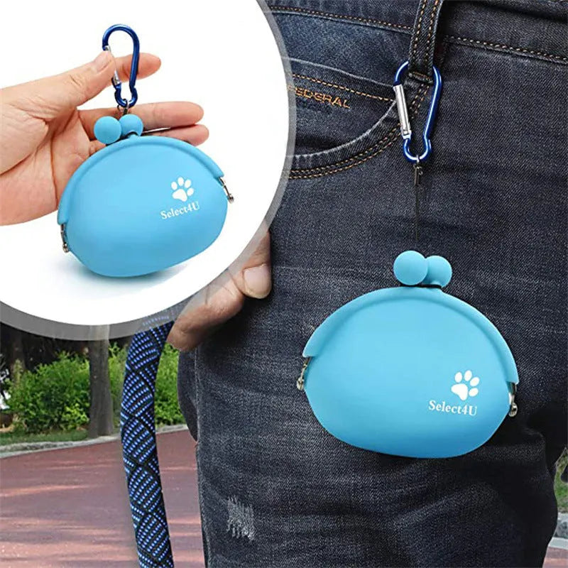 Yellow silicone dog training treat pouch with hook-and-loop strap, shown attached to a waistband.