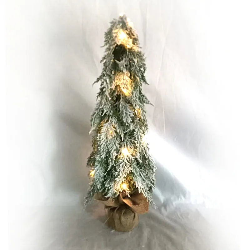 Small 24-inch white plastic Christmas tree with lights and snow sprayer decoration