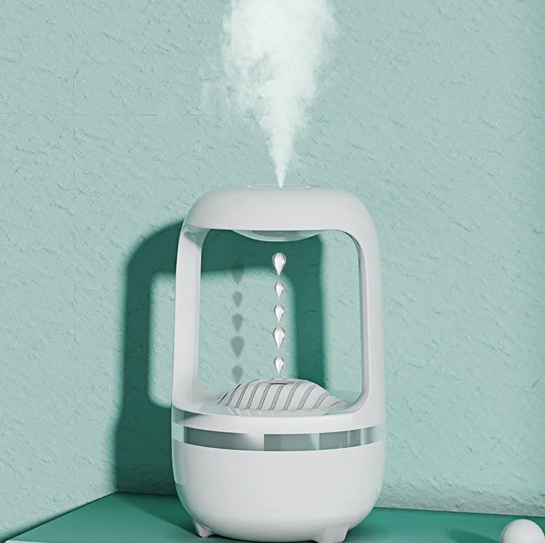 White anti-gravity water droplet humidifier with 500ml tank on a desk.