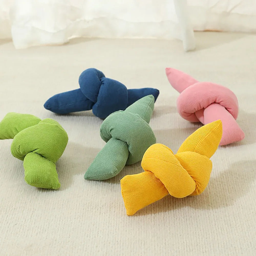 White knotted cotton rope dog toy for chewing and tug of war play.