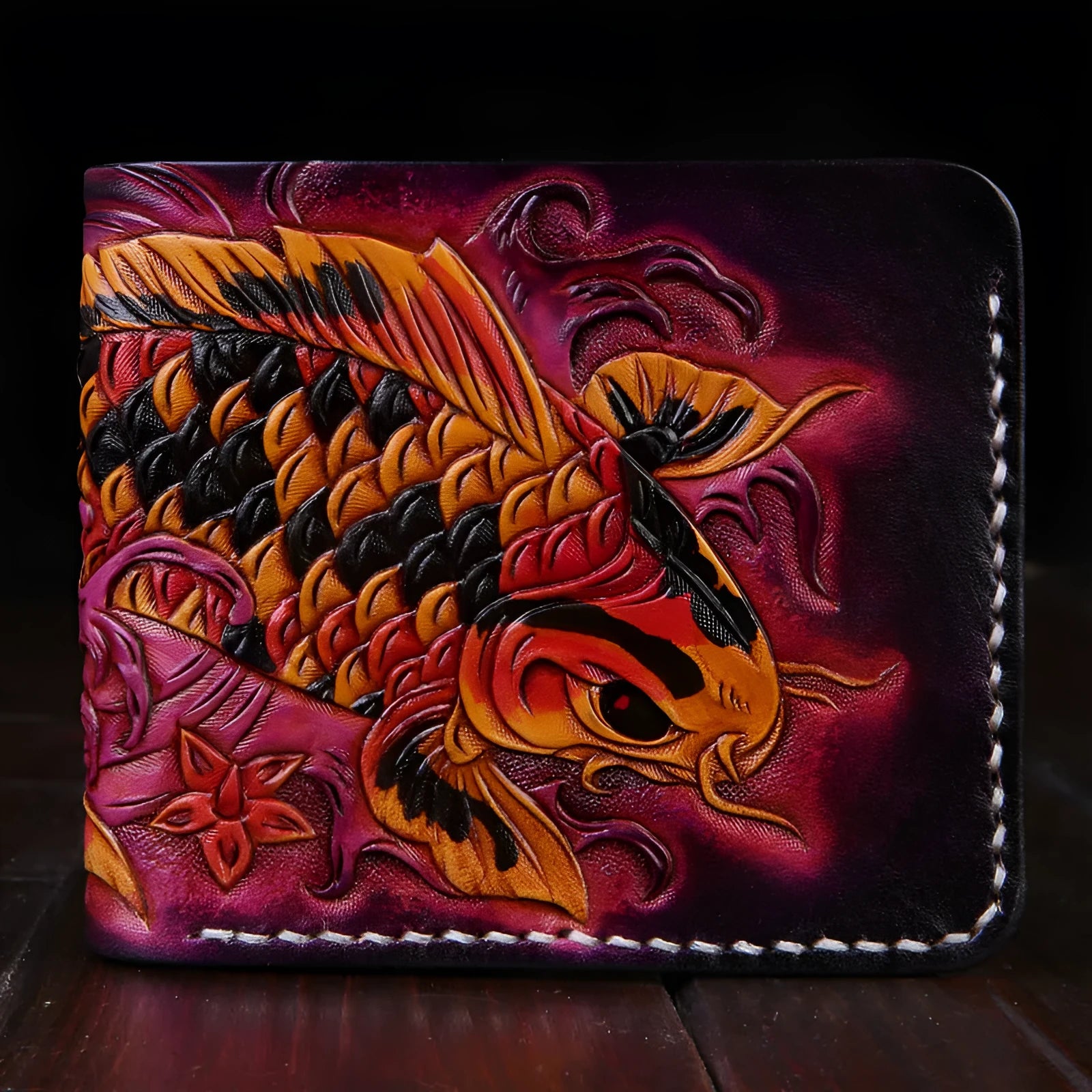 Men's cow leather wallet with carving detail in red, blue or gold colours showing open closure and compact size