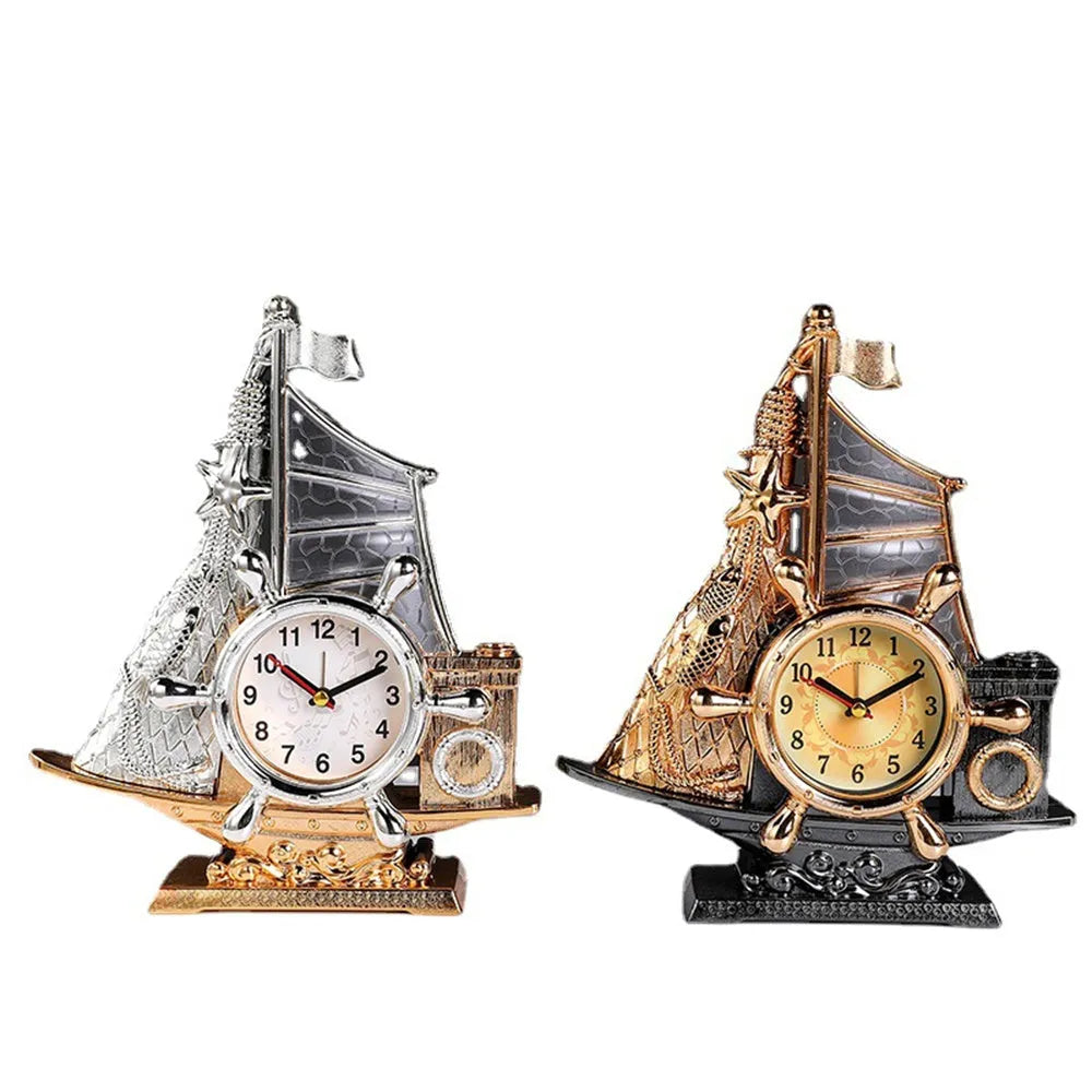 Fashion bedroom alarm clock in choice of gold or silver metallic finish on a surface.
