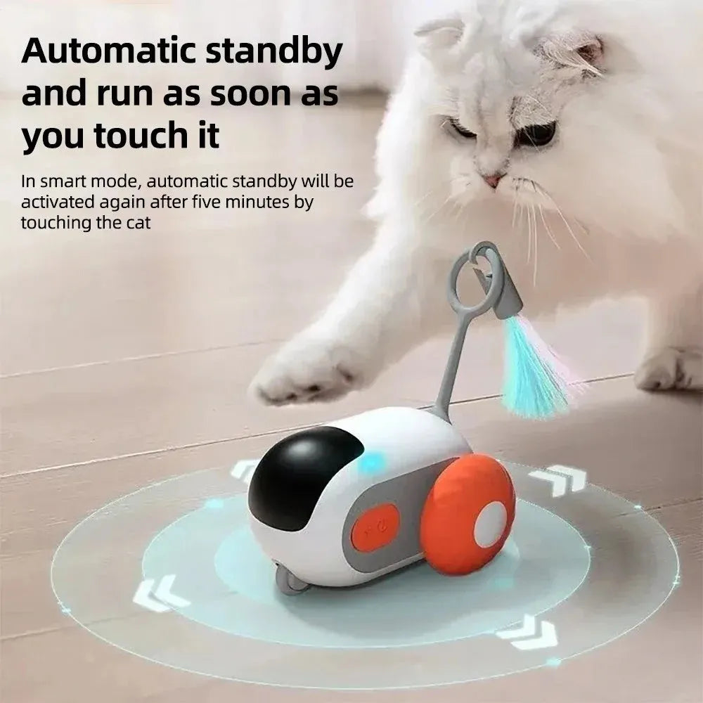Blue remote controlled cat toy car with feather teaser attachment on hard floor