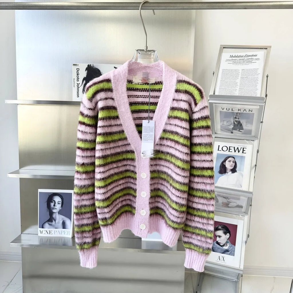 Pink women's wool knitted cardigan and pullover sweater with contrast colour detail on hanger