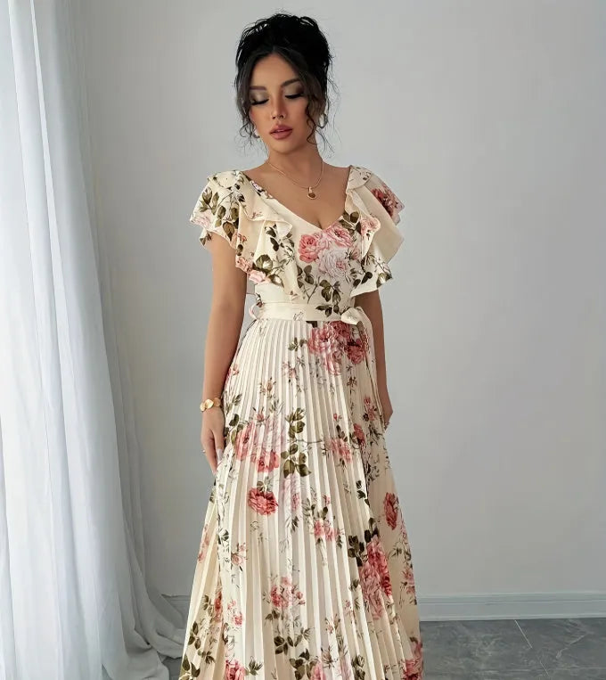 Apricot floral print V-neck dress with ruffled short sleeves and a long, flowing swing skirt.