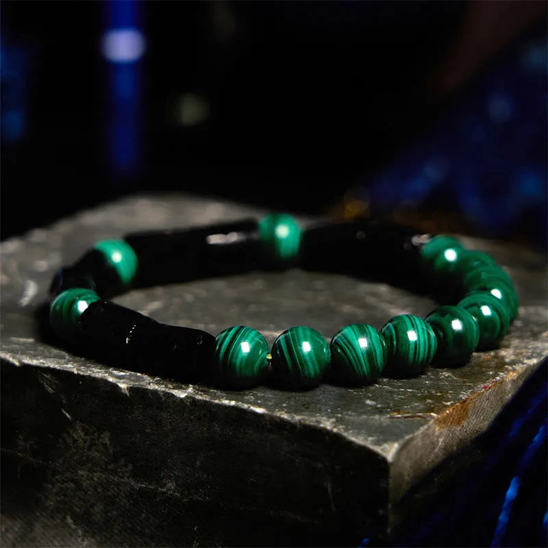 Natural obsidian stone bead bracelet with constellation design in 8mm size on wrist