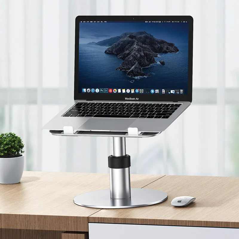 Silver adjustable car laptop stand with rotating base extended on a car seat.