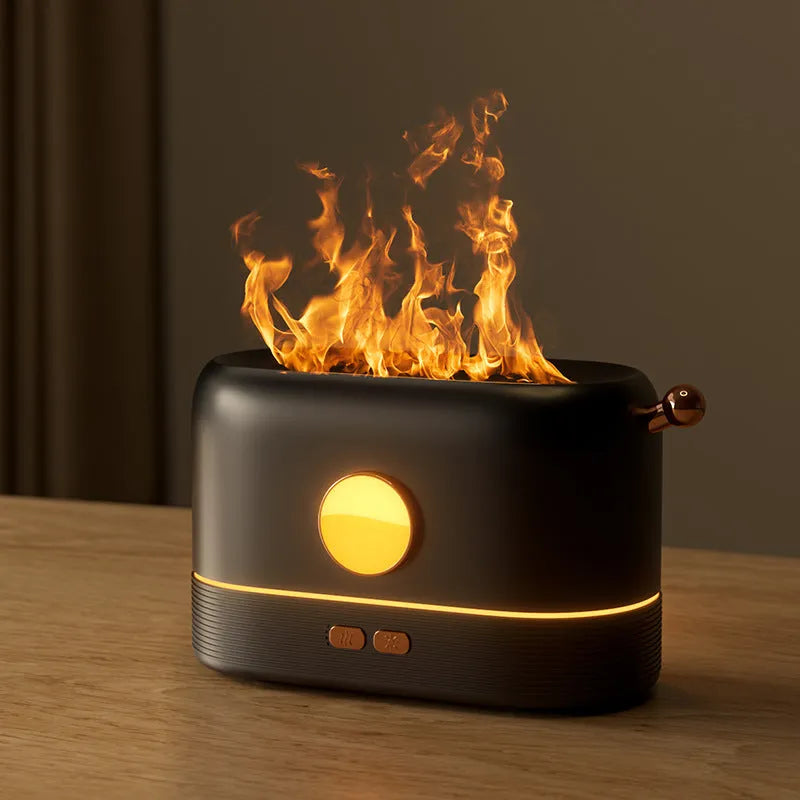 Black USB-powered desktop humidifier with glowing orange flame effect and water vapour mist.