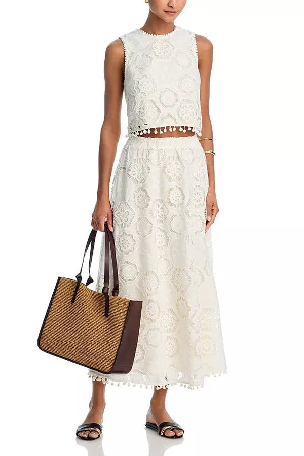 White women's sleeveless top and long embroidered skirt two-piece suit