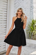 Women's black chiffon halter sundress with pleated midi skirt and adjustable waist belt.