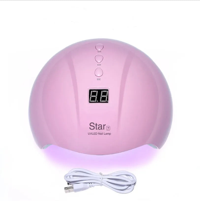 Metallic gold foil number 5 balloon and pink star balloon floating with helium ribbon.