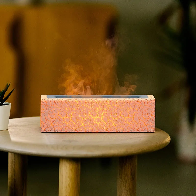 Creative square lava flame aroma diffuser and humidifier in black on a desktop with USB cable.