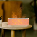 Creative square lava flame aroma diffuser and humidifier in black on a desktop with USB cable.
