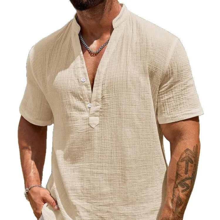 Man wearing a light blue short-sleeved stand collar shirt made from thin polyester blend fabric