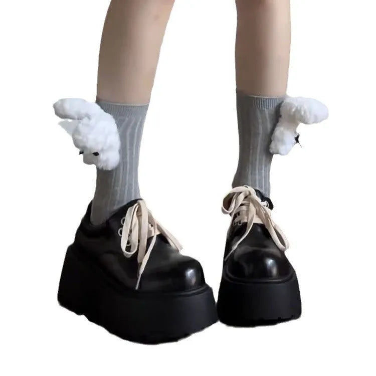 Women's matte black retro lace-up shoes with thick rubber sole and block heel.