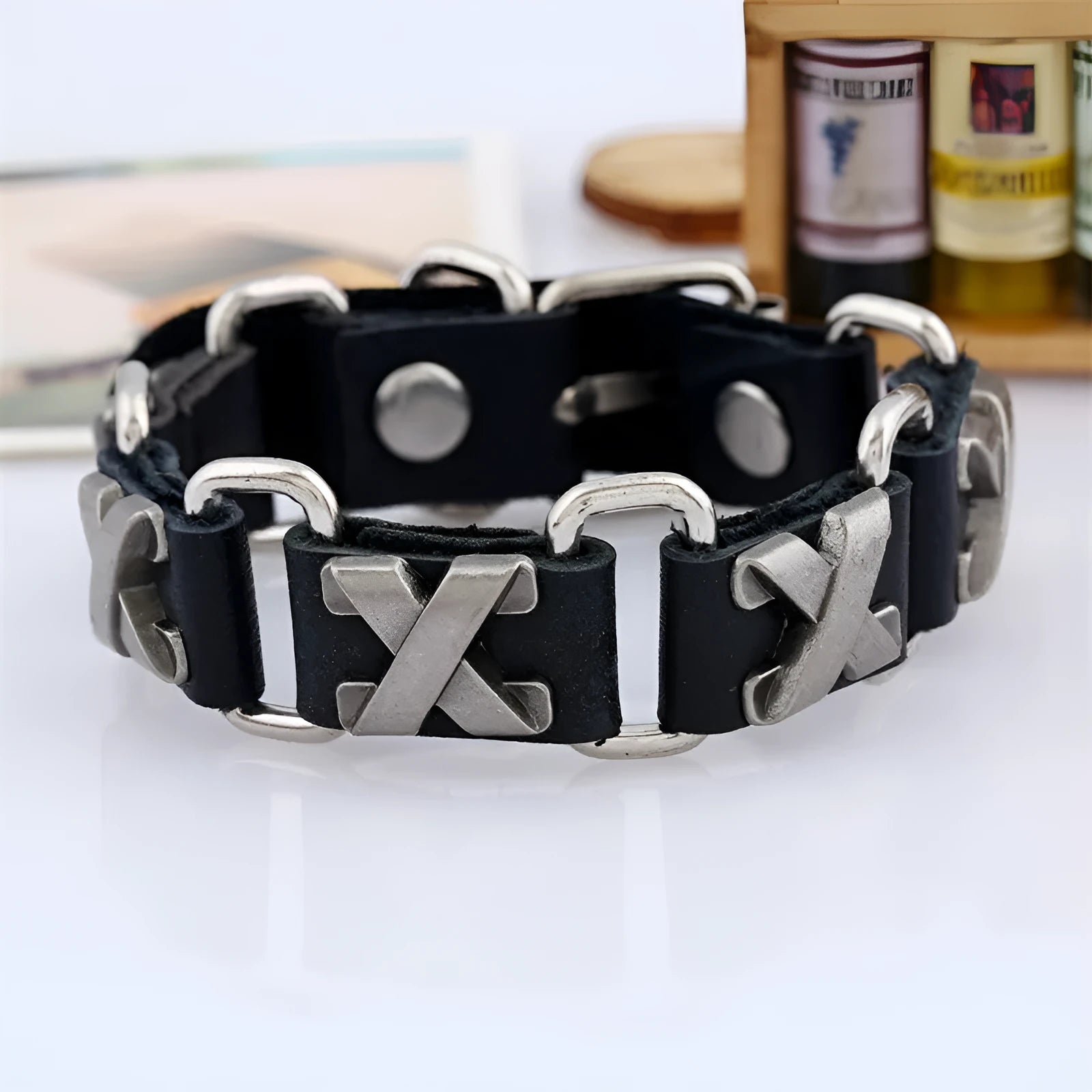 Black retro handmade leather bracelet with letter connection on a neutral background