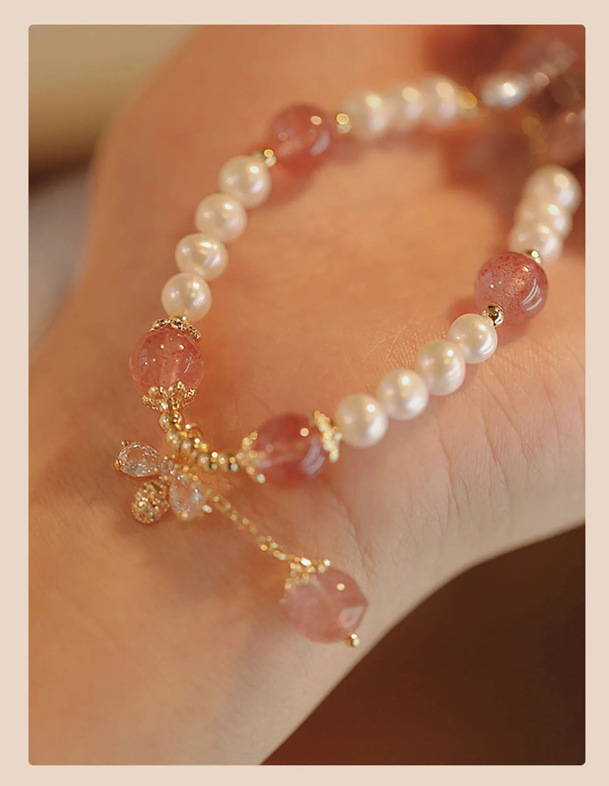 Strawberry quartz colour crystal bracelet with bow and stringed pearls.