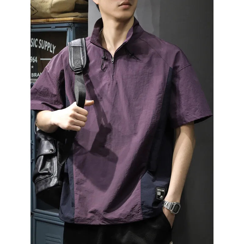 Brown men's loose fit short sleeve shirt with a half-zip stand collar, shown flat.