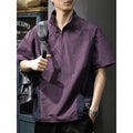 Brown men's loose fit short sleeve shirt with a half-zip stand collar, shown flat.