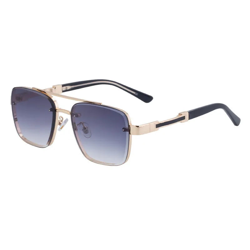 Men's vintage sunglasses with gold frame and grey lenses on a plain background.
