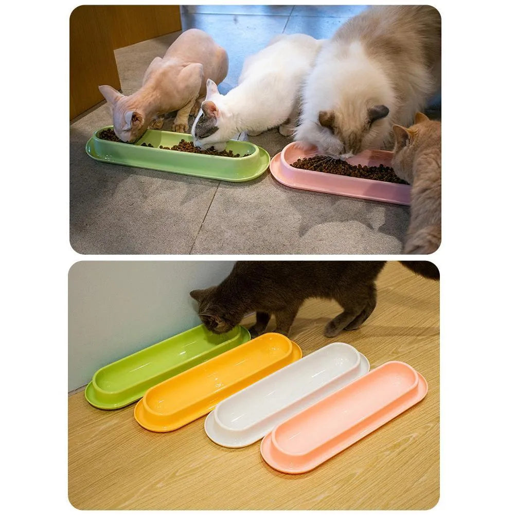 Green weighted pet bowl with anti-slip feet for cats and dogs on a floor.