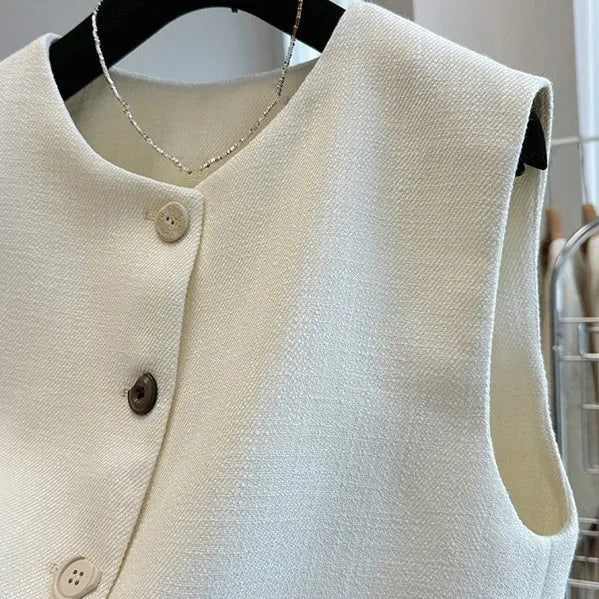 Women's French-style sleeveless bandage vest in beige, shown on a model, with a round neck and fitted silhouette.