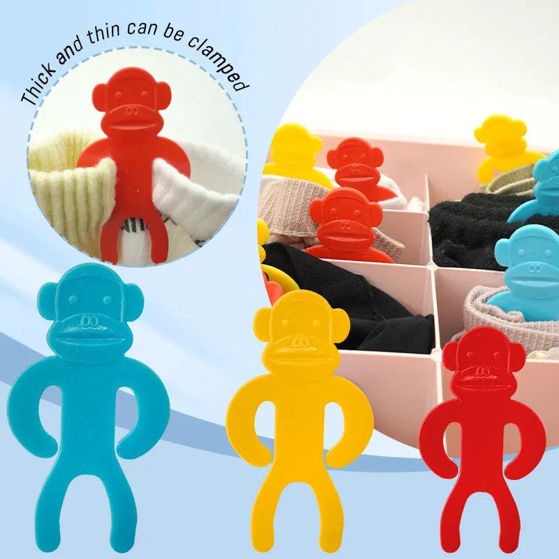 Plastic sock storage clips for laundry organisation in blue, red and yellow colours