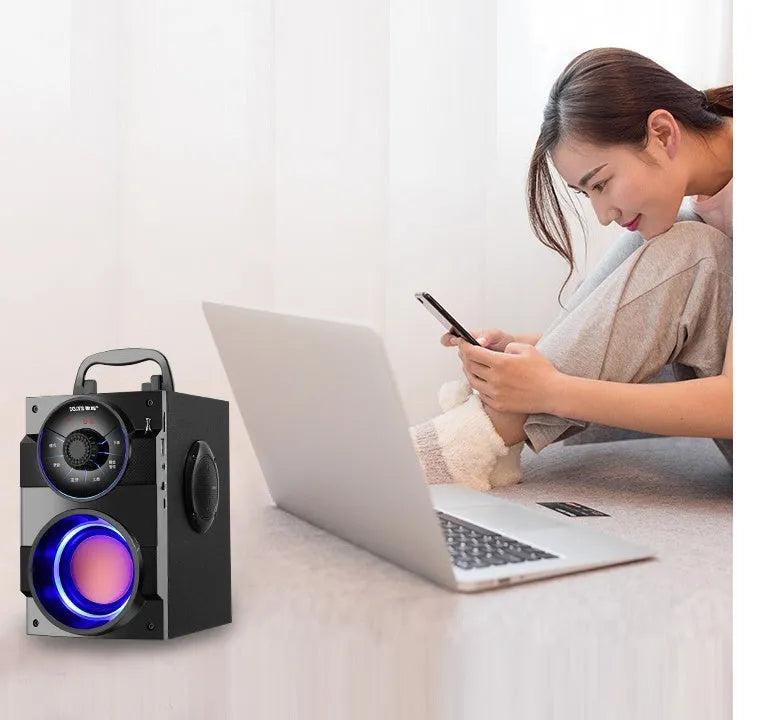 Black portable mini audio system with satellite speakers and subwoofer, 3.5mm cable, and USB power input.