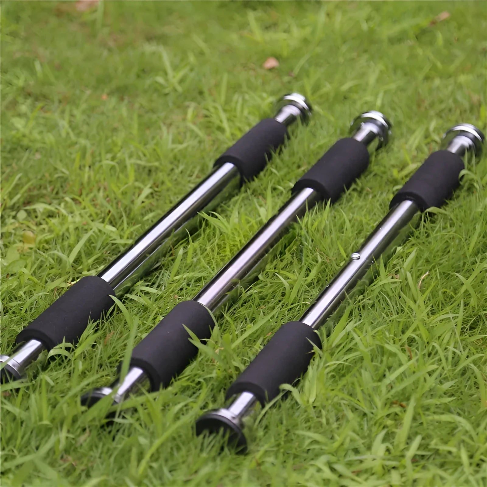 Steel adjustable pull-up bar extended between door frames for home fitness training