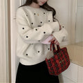 Women's acrylic pullover sweater with embroidered love pattern in loose fit with long sleeves