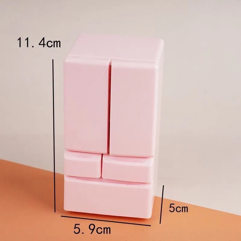 White plastic miniature candy shop toy model with LED light-up feature on display