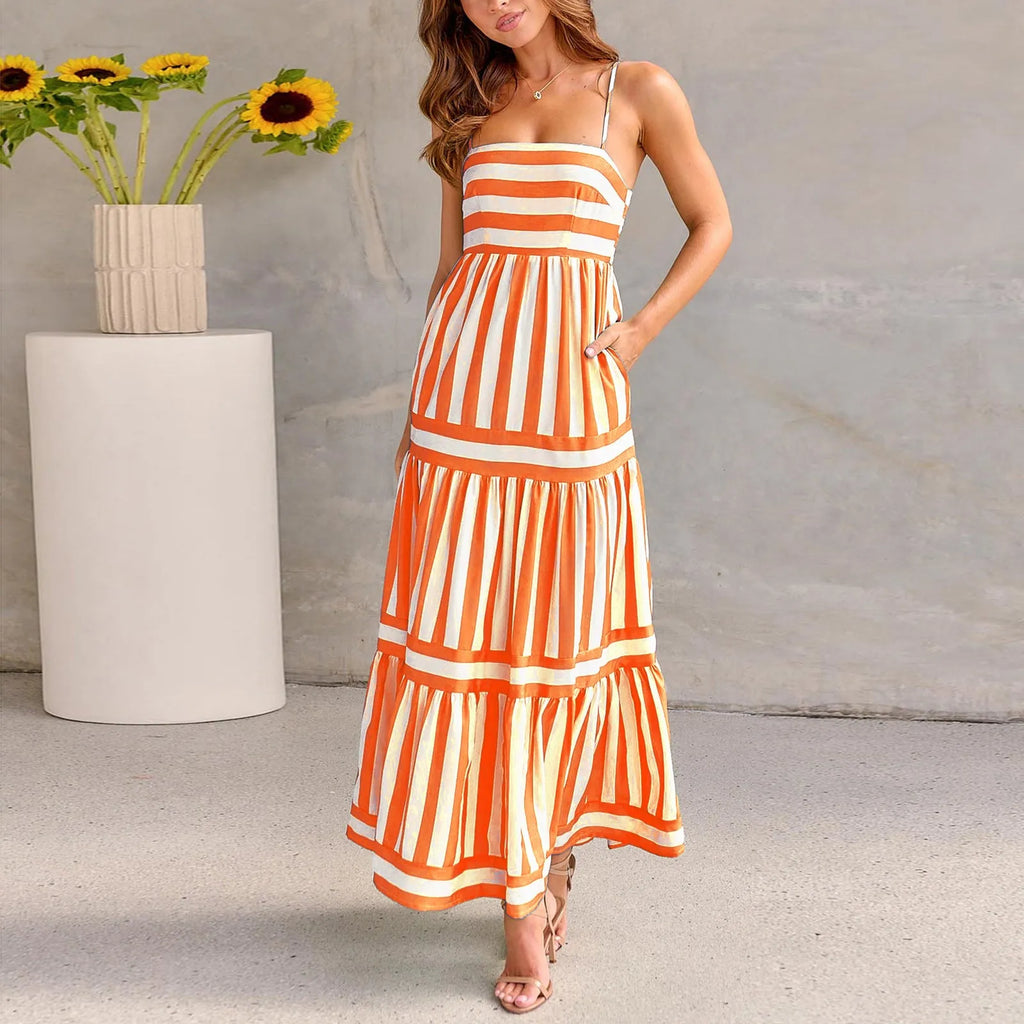Women's striped backless summer dress with shoulder suspenders and square neckline showing integrated pockets