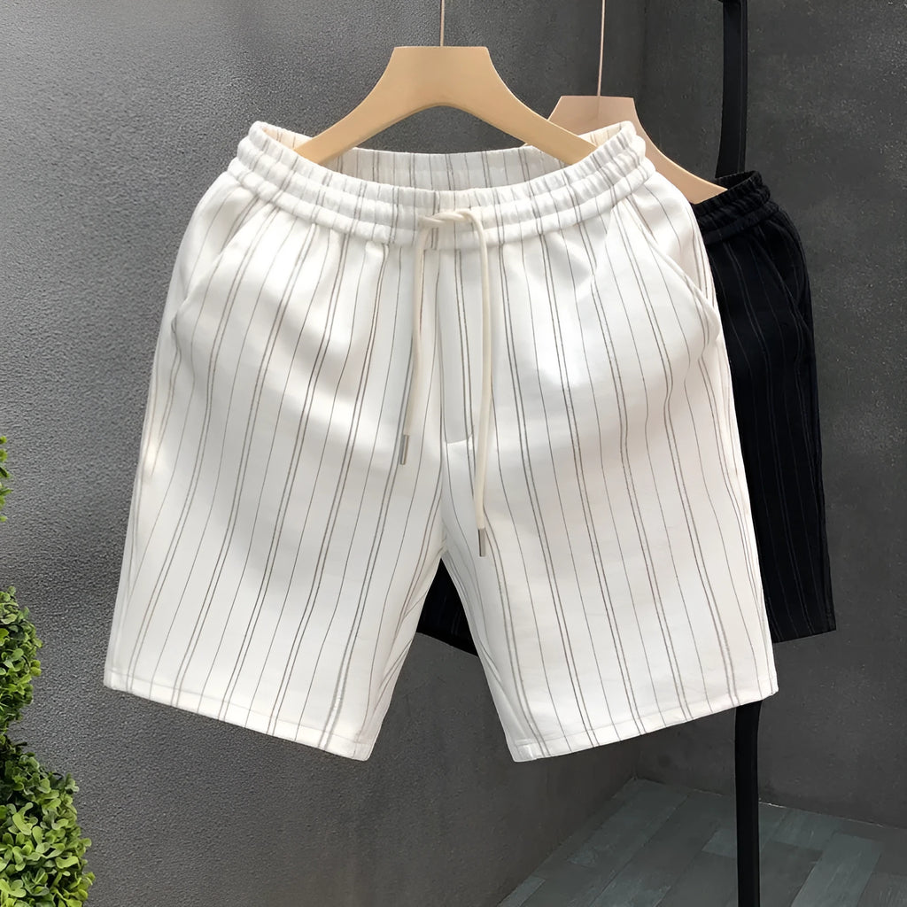Men's black and white striped casual shorts with straight cut and ankle banded hem