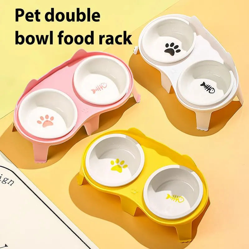 Blue ceramic cat food and water bowls sitting in a white elevated tilted stand with a hook
