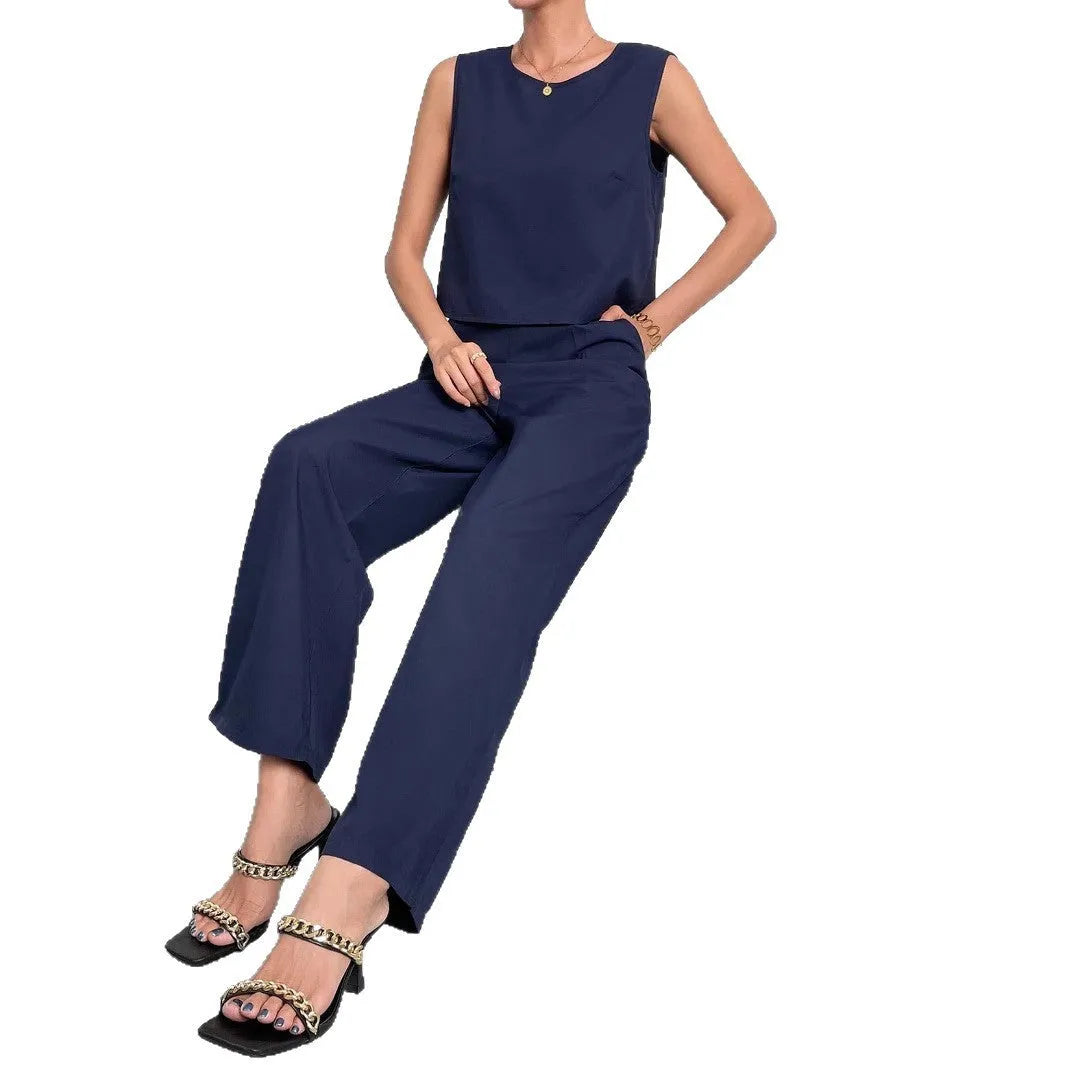 Red women's two-piece set with sleeveless top and wide leg trousers