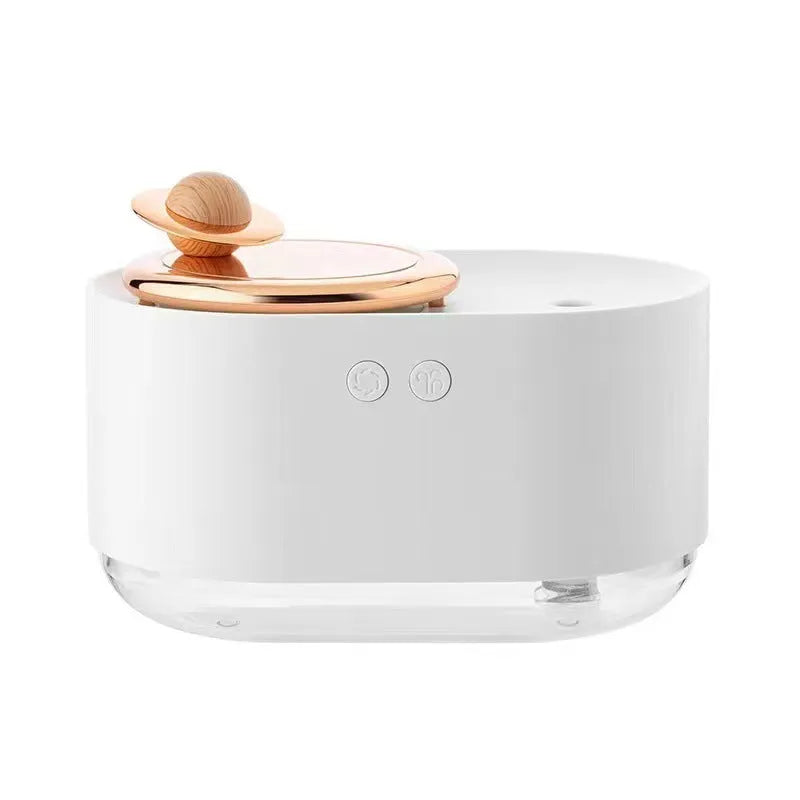 Green rotating planet-shaped desktop humidifier with night light on a wooden table.