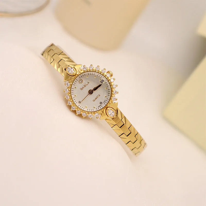 Women's vintage quartz watch with gold face and diamond embossed bracelet, slim 6mm design on a neutral background
