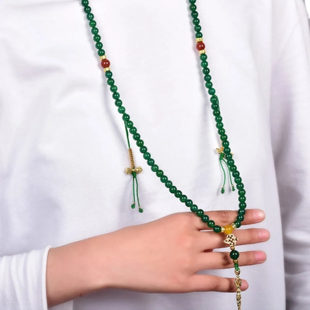 Multi-strand green agate bracelet for men and women on wrist, showing natural stone beads.